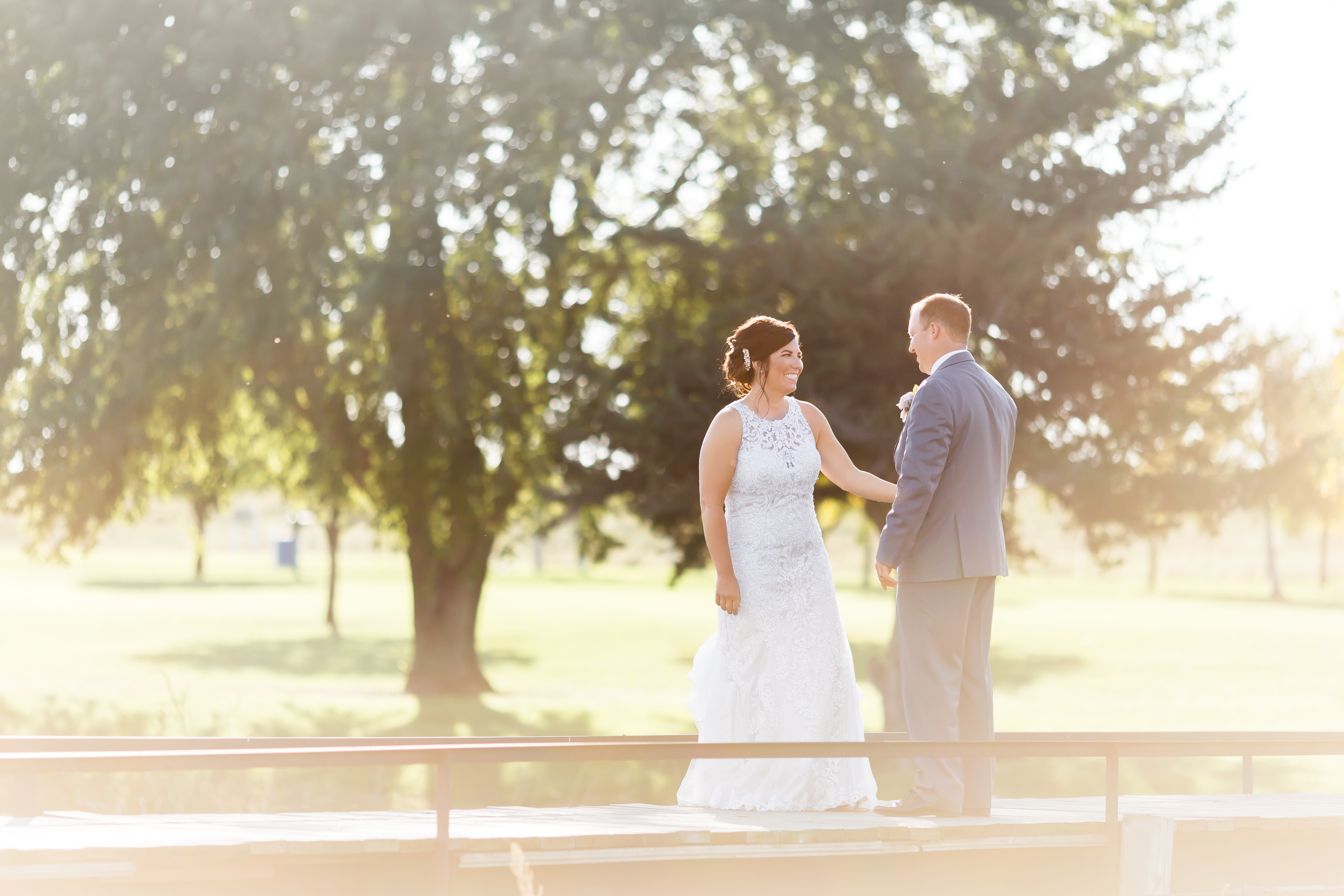 couple on bridge on wedding day