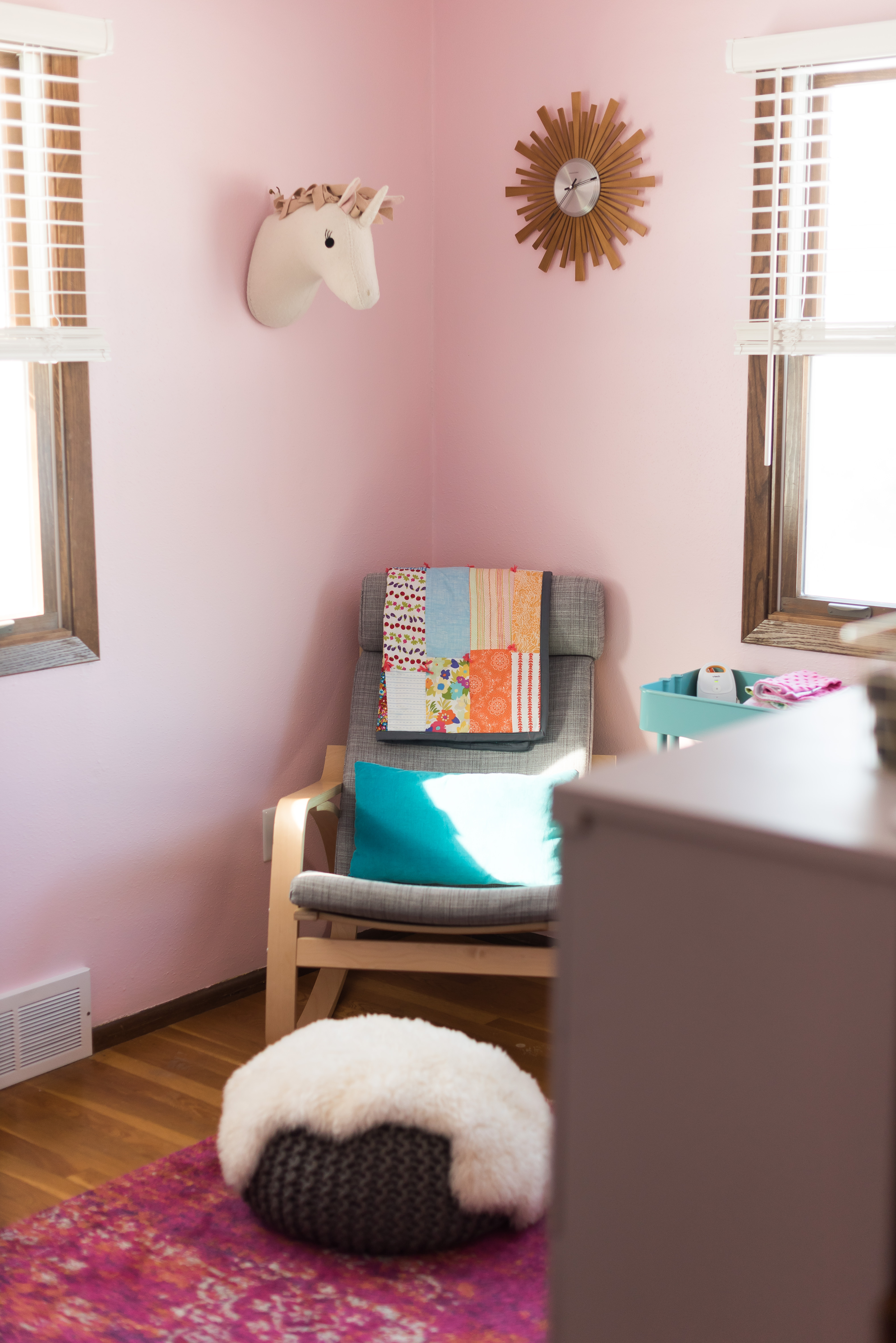 rocking chair in pink nursery