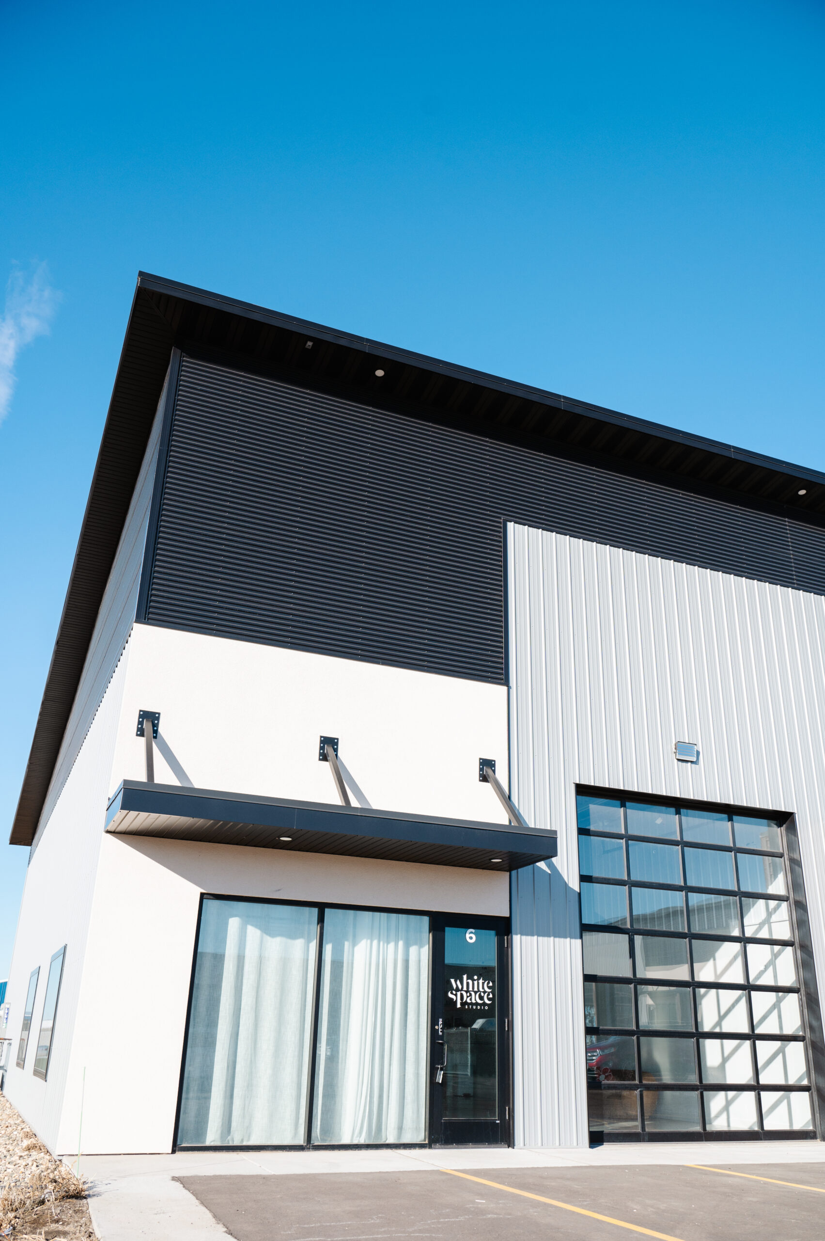 exterior photo of white space studio in Tea, SD