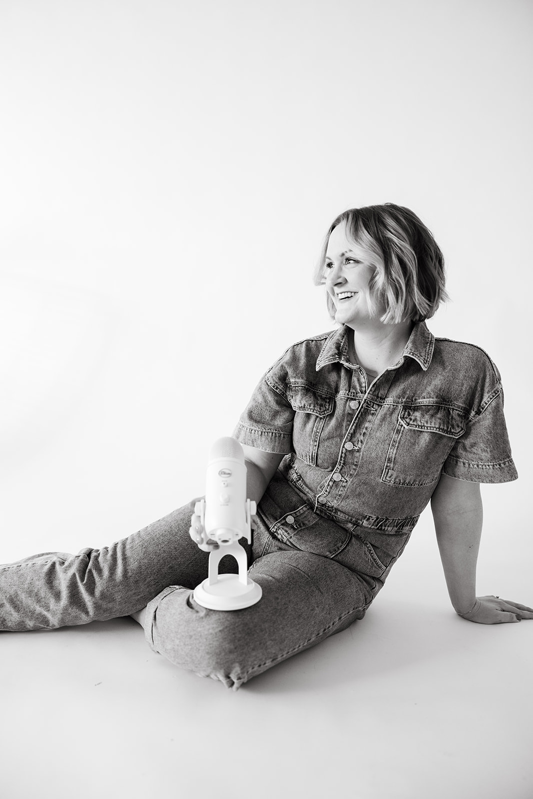 Maddie brand photo with Take It Personally podcast mic