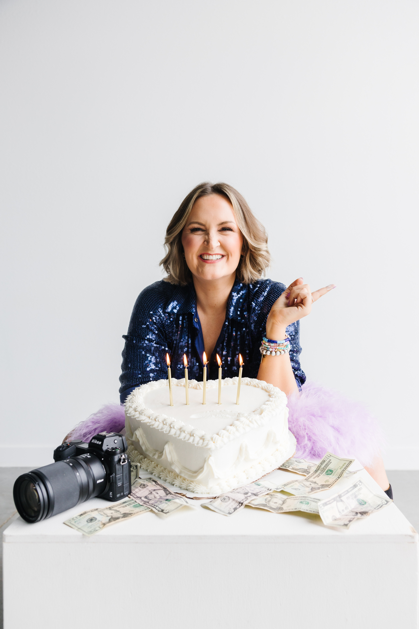 Maddie with cake celebrating business and Instagram accomplishemnts