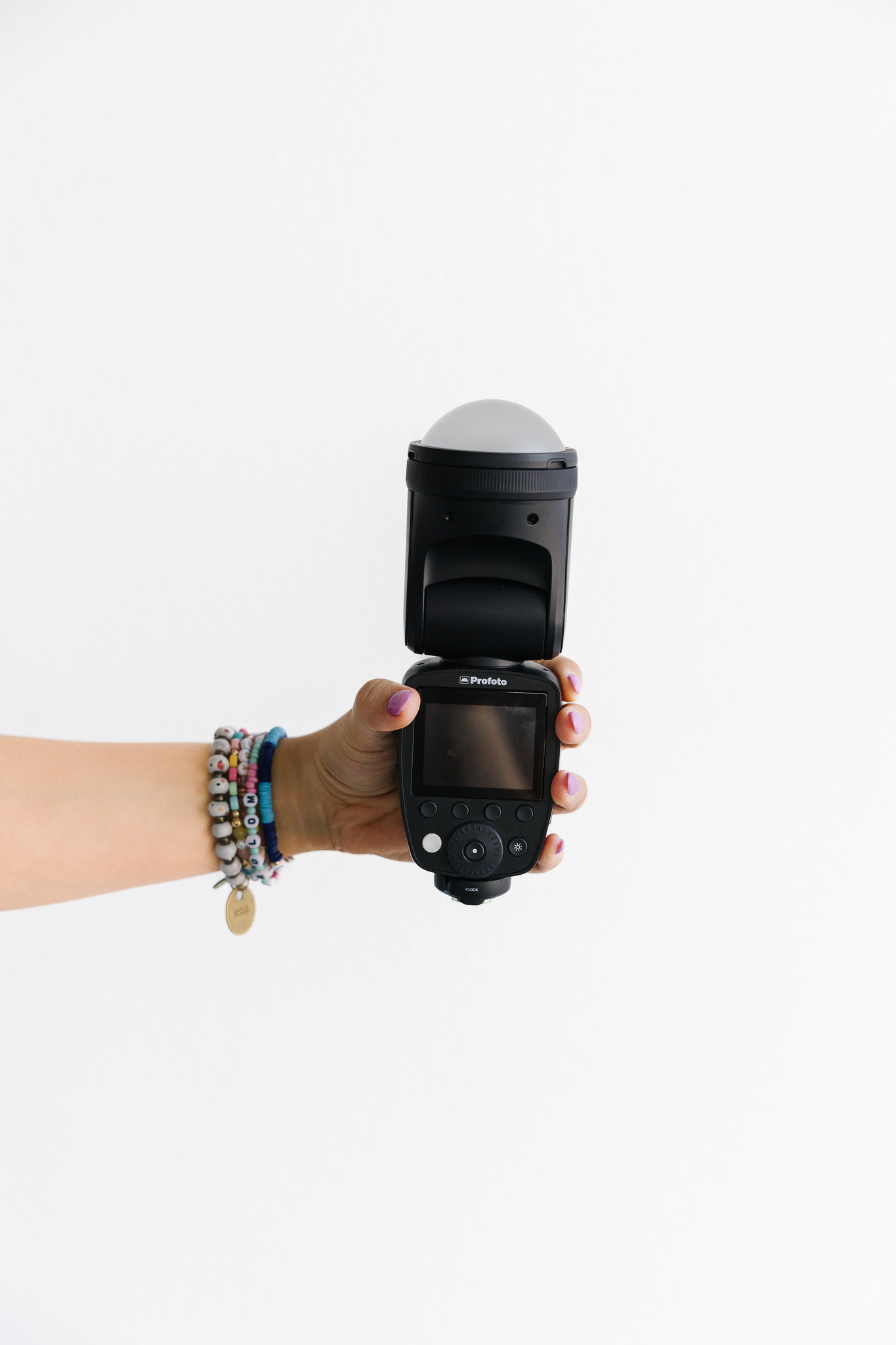 Maddie brand photographer holding up camera lens